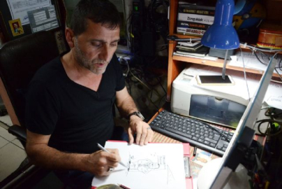 Şehrinin sorunlarını karikatürle anlayıyor