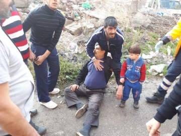 Bebeğini balkondan atarak alevlerden kurtardı